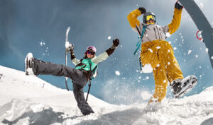 Happy couple of snowboarders are having fun. Winter holidays at Vail Ski in Vail, CO.
