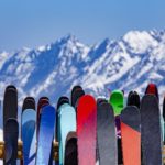 skis with a mountain background