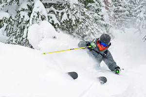 man skiing with ski gear from vail ski shop